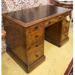 GILLOW DESK, Victorian burr walnut with nine drawers, tooled black hide and turned ebony knobs,