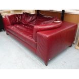 NATUZZI 'OSAKA' SOFA, with wine coloured leather upholstery, 200cm L x 70cm H.