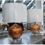 TABLE LAMPS, a pair, globe type in coppered glaze with shades, 56cm H.