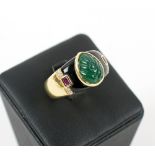 DRESS RING, yellow gold set, a pear drop green stone flanked by black enamel shoulders.