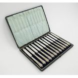 DESSERT KNIVES, a set of twelve, by Walker and Hall, Onslow pattern silver handles, Sheffield 1910,