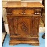 SIDE CABINET, 17th century Italian walnut with a drawer and panel door between carved pilasters,