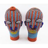 IFE BEADED HEADS, a companion pair in typical bright banded colours, 38cm H and 39cm H.