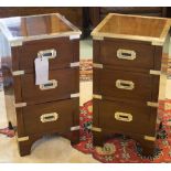 BEDSIDE CHESTS, a pair, campaign style mahogany and brass bound each with three drawers,