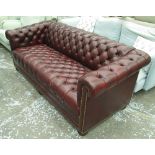 CHESTERFIELD SOFA, in buttoned burgundy leather, 86cm D x 73cm H x 191cm W.