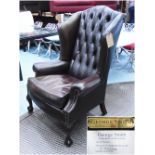 GEORGE SMITH WINGBACK ARMCHAIR, in tanned buttoned leather, label under, 87cm W.