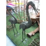 BRONZE GARDEN CRANES, a large pair, male and female authentic patinated feathered finish,