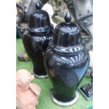 LIDDED TEMPLE JARS, a pair, in black glaze on metal base, 83cm H.