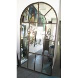 ORANGERY MIRRORS, a pair, with domed tops on a distressed metal frame, 206cm x 109cm.