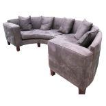 DEMI LUNE SOFA, in brown alacantra on block supports with four cushions, 317cm W.