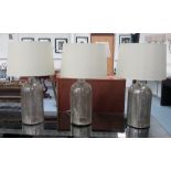 GLASS LAMPS, three, silvered finish, bases each 41cm H.