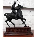 FIGURINE, horse and jockey cast on a wooden base, 31cm W x 38cm H x 15cm D.