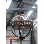 HANGING LANTERN, globe form in a bronzed metal frame, 51cm diam plus chain.