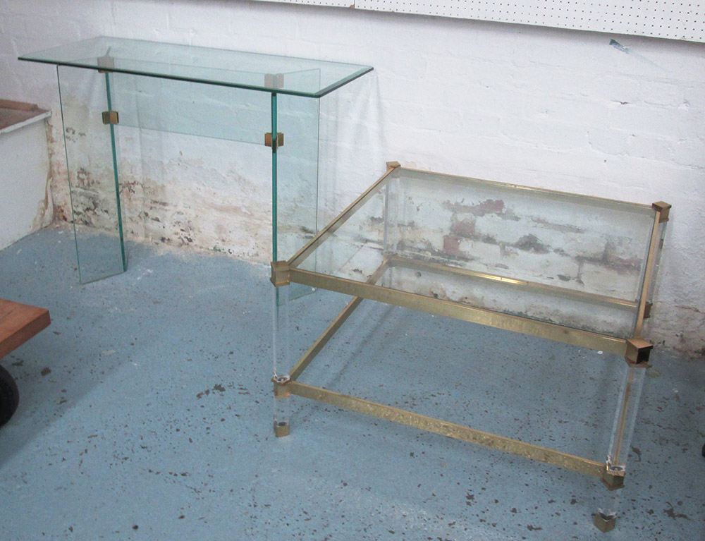 LOW TABLE, square with a glass top on perspex supports,