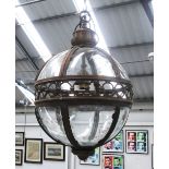 HANGING LANTERN, globe form in a bronzed metal frame, 51cm diam plus chain.