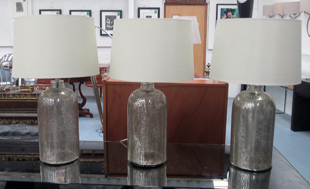 GLASS LAMPS, three, silvered finish, bases each 41cm H.