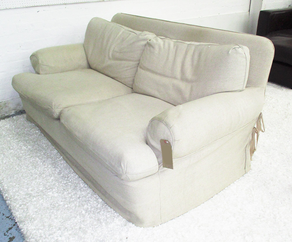 KINGCOMB SOFA, two seater, with oatmeal linen style loose covers, 178cm L x 82cm H.