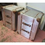 AVIATOR STYLE BEDSIDE CHESTS, a pair, with two short drawers below and carrying handles,