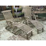 STEAMER ARMCHAIRS, a pair, weathered slatted teak, hinged and folding.