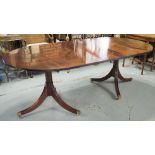 TWIN PEDESTAL DINING TABLE, Regency style mahogany with extra leaf and brass clips,