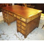 PEDESTAL DESK, Georgian style walnut with red leather top over nine drawers,