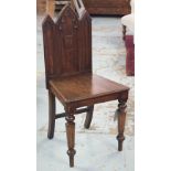 HALL CHAIRS, a pair, William IV Gothic oak with triple arched panelled backs and faceted supports.