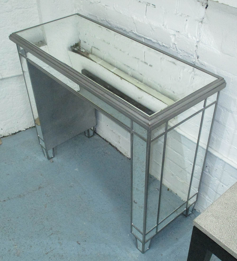 CONSOLE TABLE, rectangular silver and mirror clad with moulded top and slab supports,