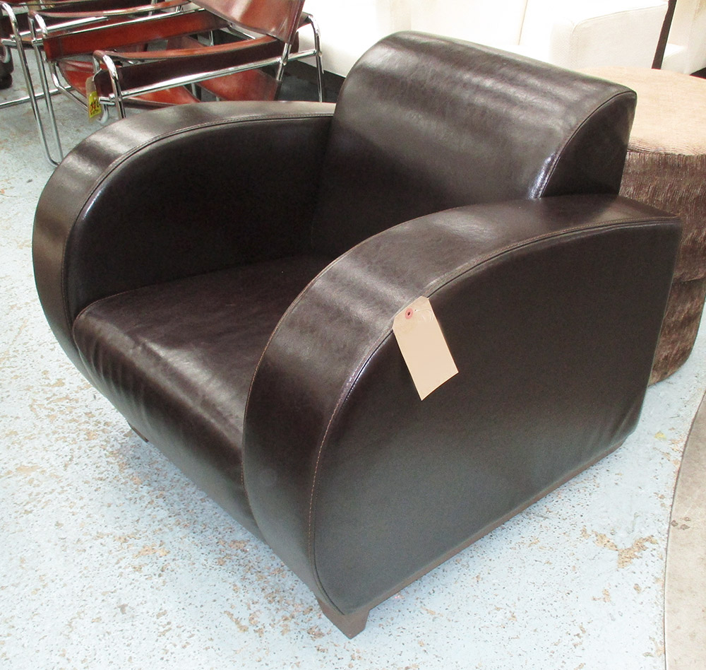 ARMCHAIR, in dark brown leather Art Deco style on square supports.