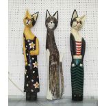 WOODEN CATS, a set of three, solid wood painted finish, 97cm H x 7cm to 9cm W.