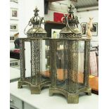 STORM LANTERNS, a pair, in bronzed metal filligree corners, 65cm H.