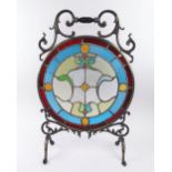 FIRE SCREEN, Victorian steel with armorial stained glass centre, 74cm H x 48cm W max.