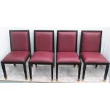 DINING CHAIRS, a set of four, in burgundy on wooden framed with metal caps, 48cm W.
