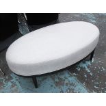 OTTOMAN, oval shaped in neutral fabric on ebonised square supports, 124cm x 70cm x 42cm H.