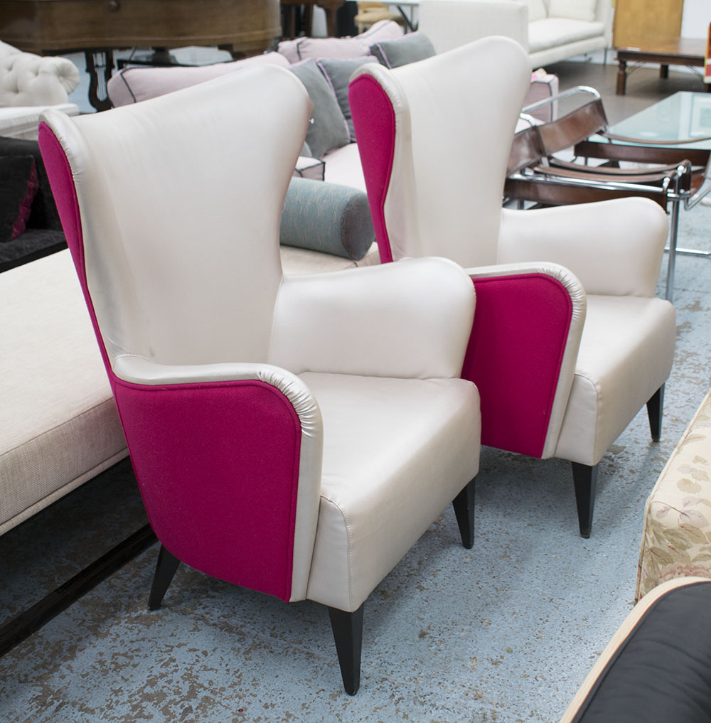WING BACK CHAIRS, a pair, with silvered upholstery and contrasting pink felt backs,