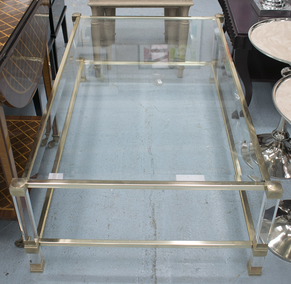 OCCASIONAL TABLE, by Pierre Vandel, with glass top on brass effect frame with lucite sections,