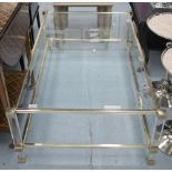 OCCASIONAL TABLE, by Pierre Vandel, with glass top on brass effect frame with lucite sections,