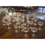 GLASSES, a suite, Greek key etched with cut faceted stems, thirty pieces,