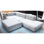 HAY 'MAGS SOFT' CORNER SOFA AND OTTOMAN, in grey fabric with stitched edging on block supports,