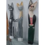 WOODEN CATS, a set of three, carved solid wood painted finish, 97cm H x 9cm W.