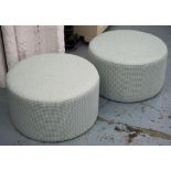 OTTOMANS, a pair, cylindrical form in pale blue fabric, 34cm H x 62cm.