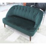 MARGOT SOFA, two seater, in bottle green fabric on turned supports, 128cm L.