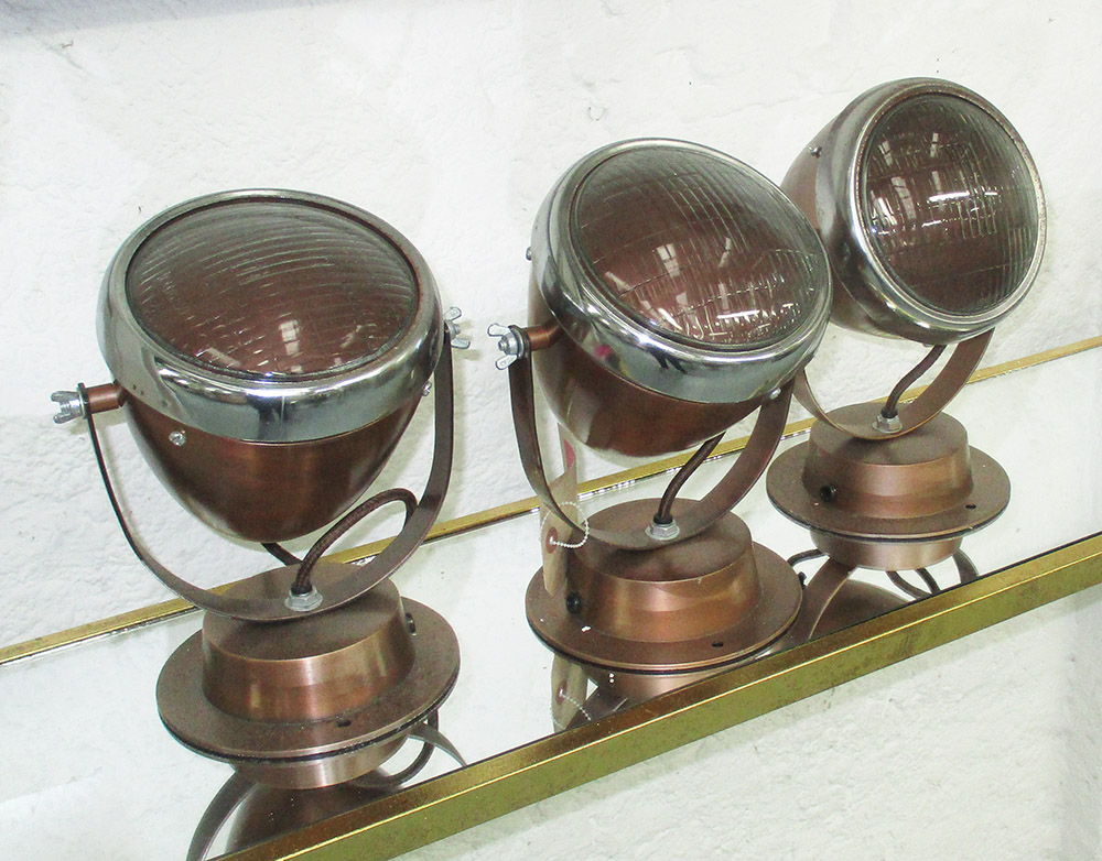 WALL LIGHTS, a set of three, in the style of Vespa motorcycle head lamps,