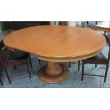 EXTENDING DINING TABLE, with internal leaf, oval on heavily carved central stand,