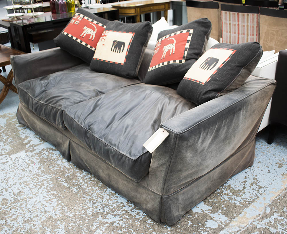 SOFA BED, two seater, with faux black leather and loose covers, 209cm W.