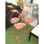 GARDEN FLAMINGOS, a set of four, in painted metal finish, 105cm H.