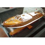 MODEL MOTOR BOAT, in wood on stand, 67cm L.