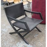 ARMCHAIR BY FLEXFORM, in black leather on an ebonised X framed base, 60cm W.