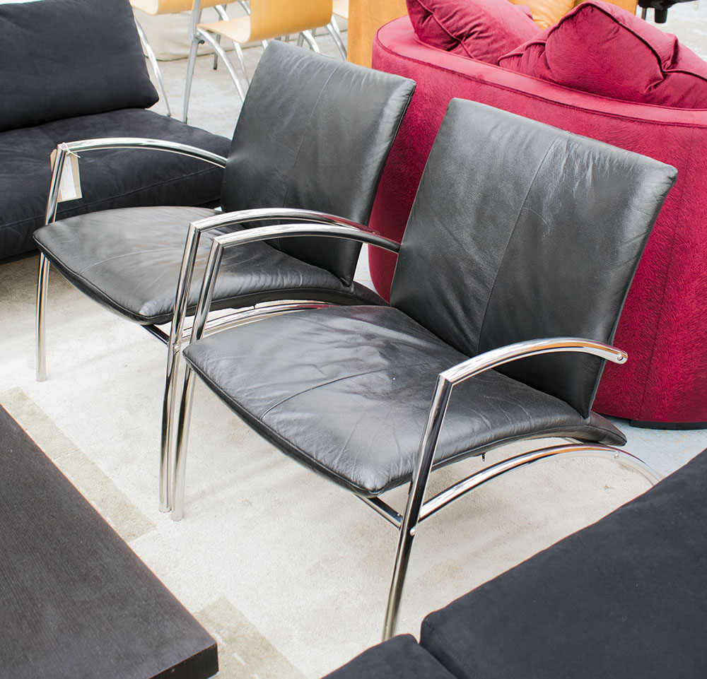'SIT' CHAIRS BY KEBE, 2001, a pair, in black leather on a chromed metal frame, 65cm W.