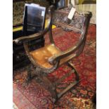 SAVONAROLA CHAIR, in carved oak, leather seat, 61cm W.