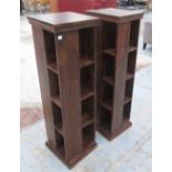 CD/BOOK STANDS, a pair, Indonesian hardwood revolving, 35cm x 35cm x 111cm H.